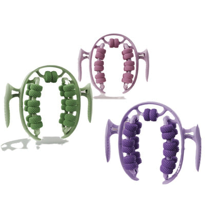 Three circular leg massagers in green, purple, and pink with textured rollers and handles for beauty and slimming massage.