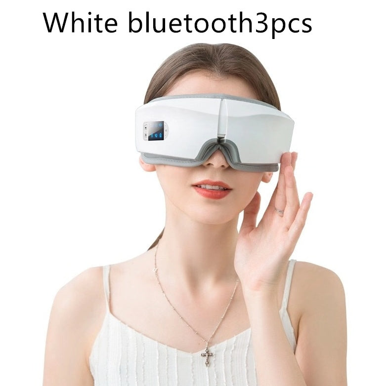 Woman wearing a white rechargeable eye protector with Bluetooth and LCD screen for eye massage and relaxation