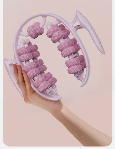 Light pink leg massager circular with textured rollers held in hand for slimming and beauty massage.