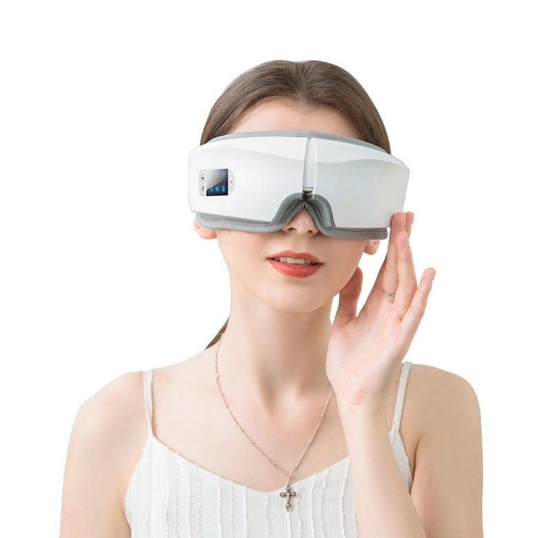 Woman wearing a rechargeable eye protector massager with Bluetooth and LCD display