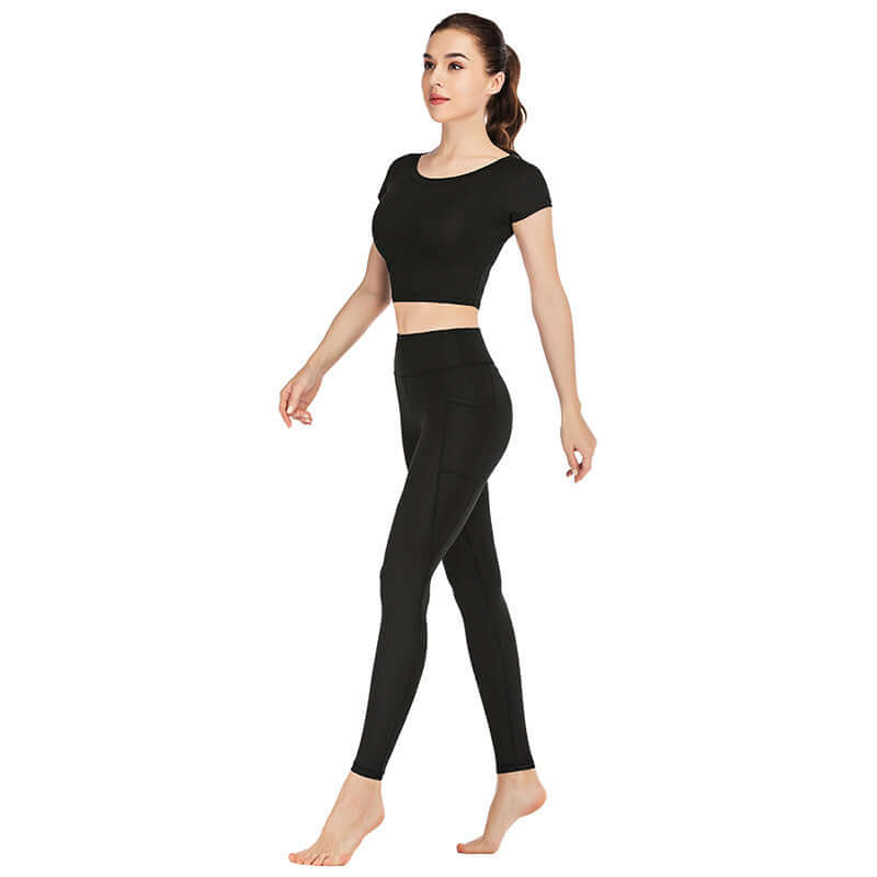 Woman wearing black pocket yoga clothes suit in sizes S M L XL made of versatile lycra fabric