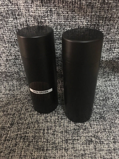 Hair Bun Powder in dark brown cylindrical containers for voluminous hair styling