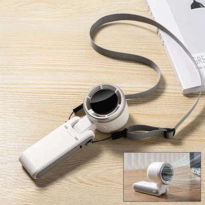 Compact white hanging neck mini fan with Type-C charging port and foldable design on wooden surface