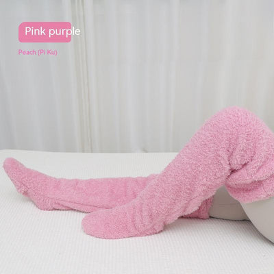 Pink purple over knee high fuzzy socks for warm winter comfort.