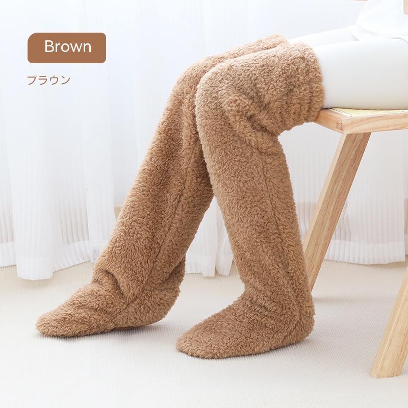Over knee high fuzzy brown socks for winter warmth.