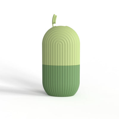 Green silicone ice cube tray mold with ribbed design and conjoined sealing cover.