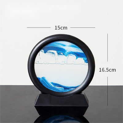 Quicksand painting hourglass ornament with blue and white sand in a circular frame, 15cm wide, 16.5cm tall.