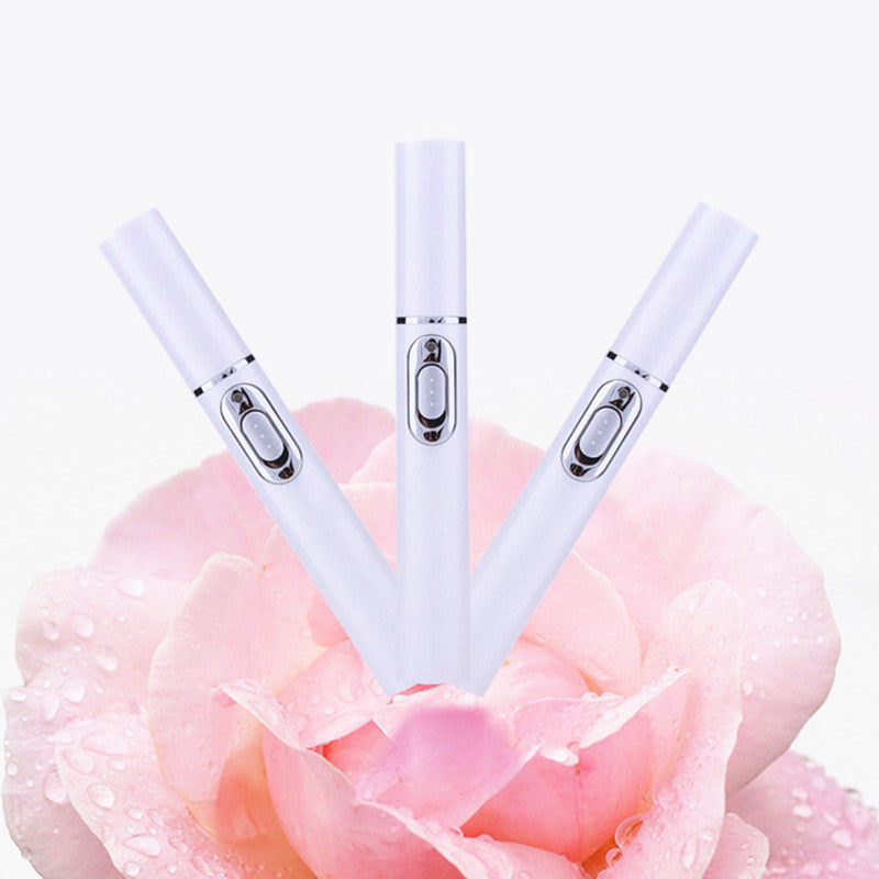Portable Acne Laser Pen for wrinkle removal and blue light therapy, displayed on a pink rose background.
