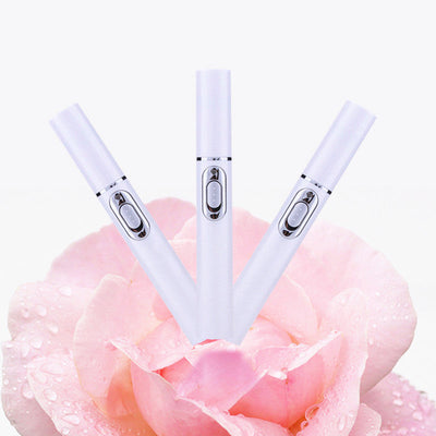 Portable Acne Laser Pen for wrinkle removal and blue light therapy, displayed on a pink rose background.