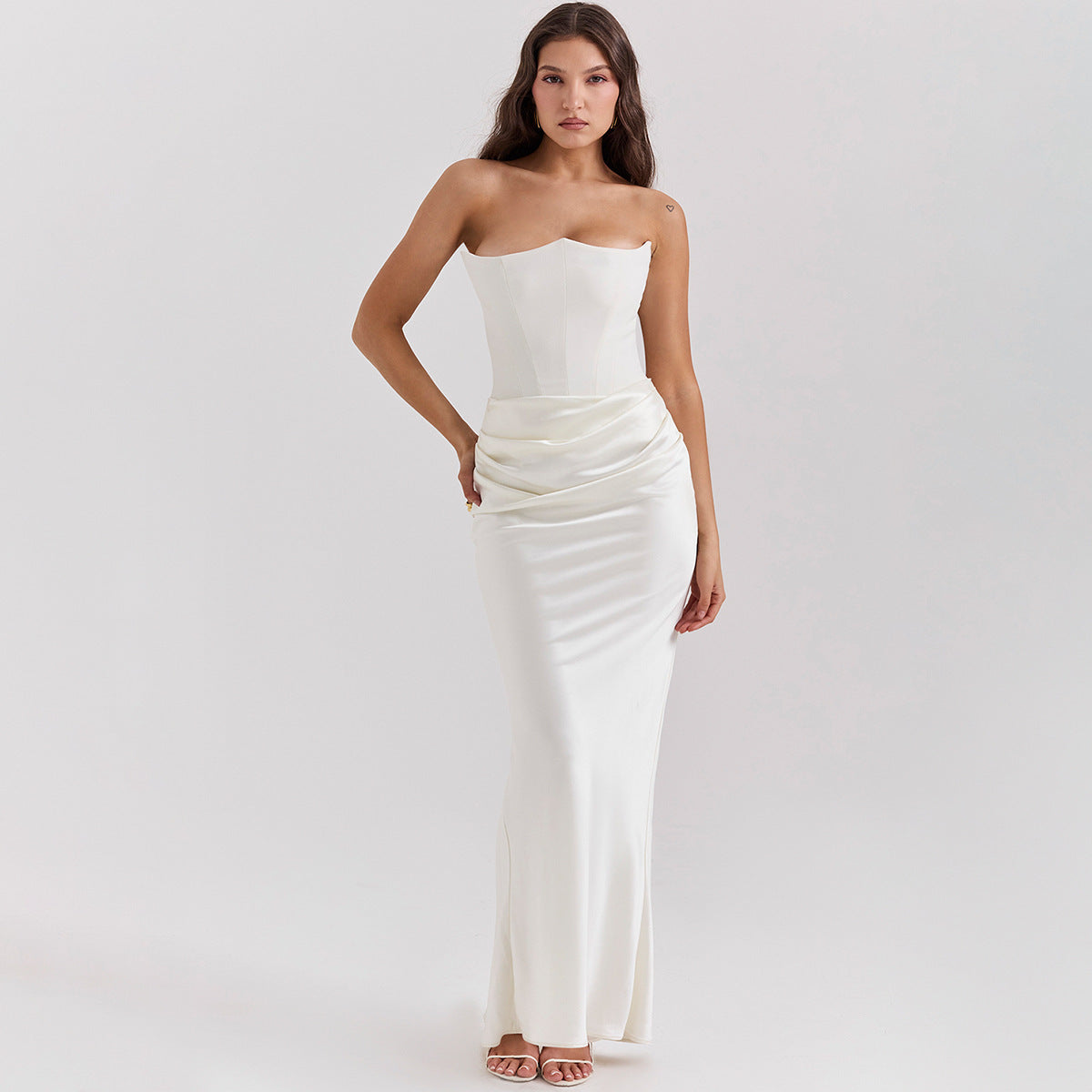woman wearing slim tube top long white backless evening gown sexy style