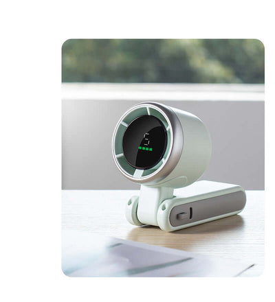 Portable folding mini fan with turbo speed and Type-C input interface on wooden surface