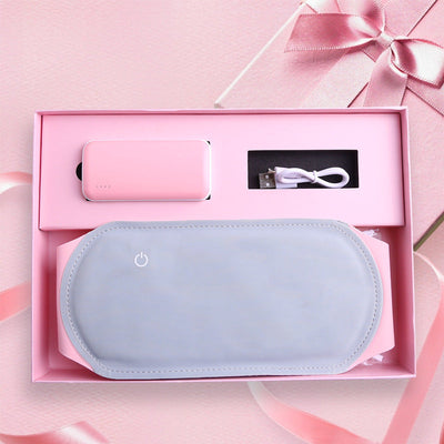Warm Heart Heating Belt in gray with pink packaging, USB cable, and portable power bank for menstrual pain relief.