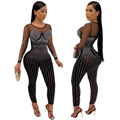 woman wearing black see-through mesh long sleeve mid waist jumpsuit with sparkling diamond accents and pencil pants posing side and front views