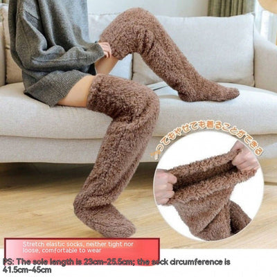 Over knee high fuzzy brown socks for winter warmth and comfort.