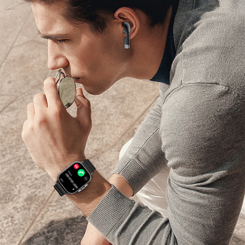 Man wearing cross-border new arrival smartwatch and TWS Bluetooth headset making a call outdoors