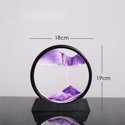 Quicksand painting glass ornament with purple sand art in a round frame.