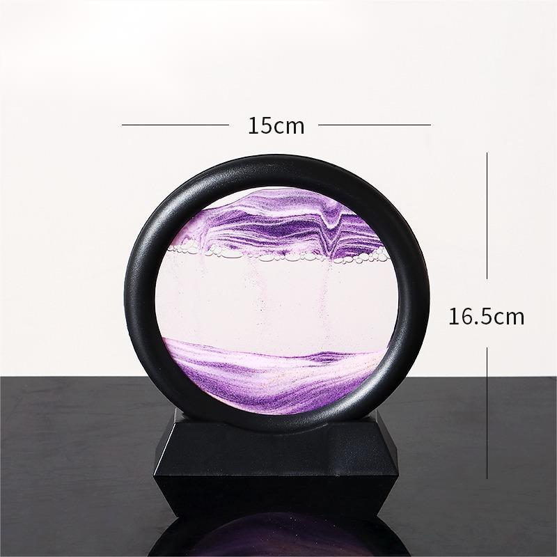 Quicksand painting hourglass ornament with purple sand in black frame.