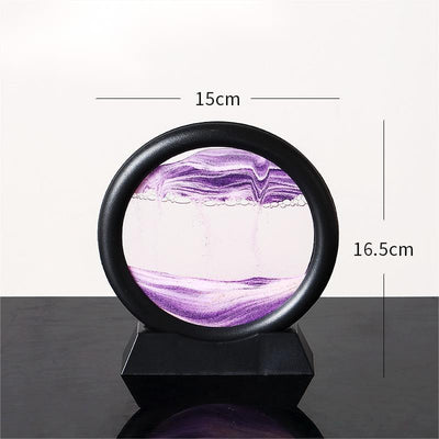 Quicksand painting hourglass ornament with purple sand in black frame.