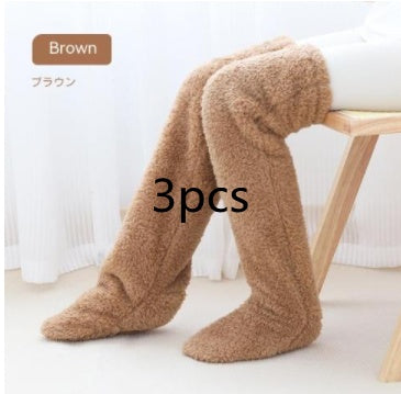 Brown over knee high fuzzy socks for warmth and comfort.